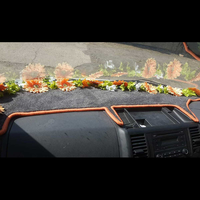 T5 dashboard mat shown in black carpet with orange trim