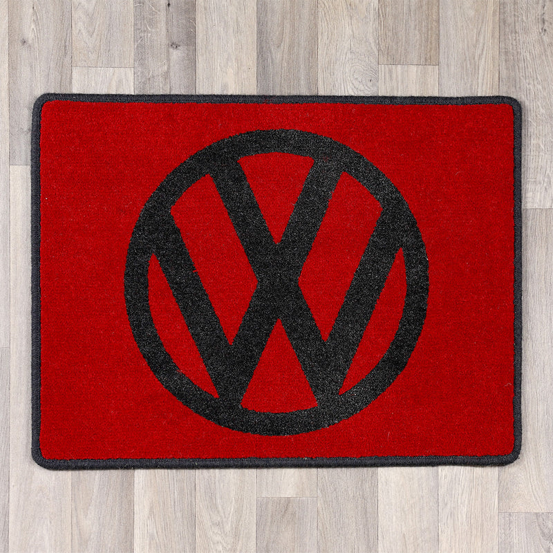 rectangular rug with vw logo in red and black