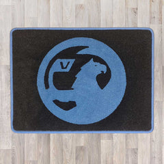 Vauxhall rectangle floor rug shown in black carpet with blue binding