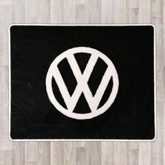 Large rectangular floor rug with VW circle logo shown in black carpet with white carpet logo