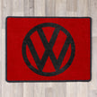 rectangular rug with vw logo in red and black