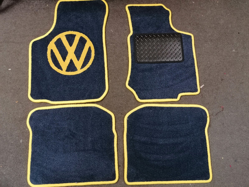 New Beetle rug set shown in dark grey carpet with blue binding.