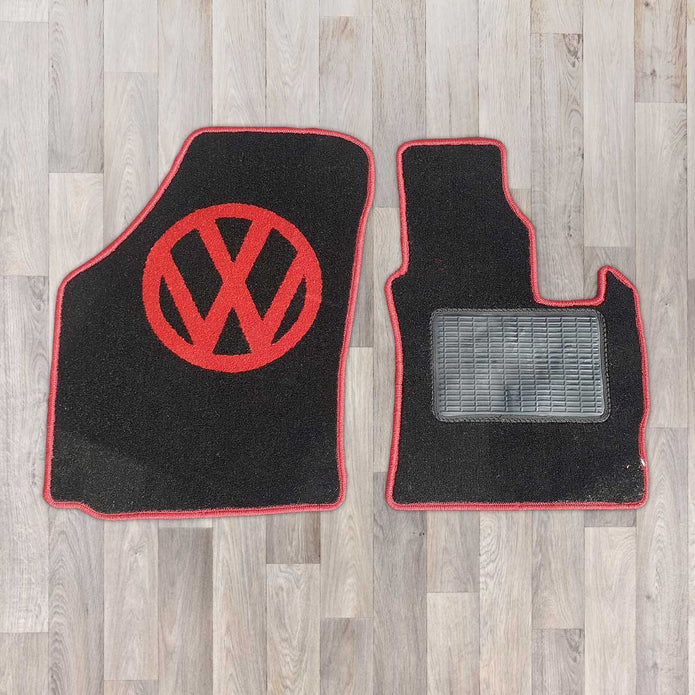 Caddy 2003 to 2020 rug set shown in black carpet with red binding.
