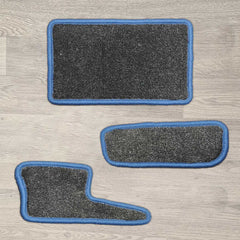 Ford Transit Custom 2020 dash mat set shown in dark grey carpet with blue binding