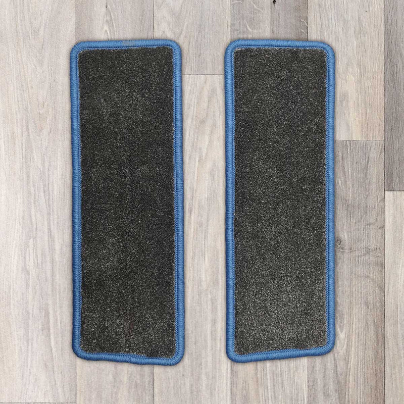 Ford Transit Custom side step rugs shown in black carpet with blue binding