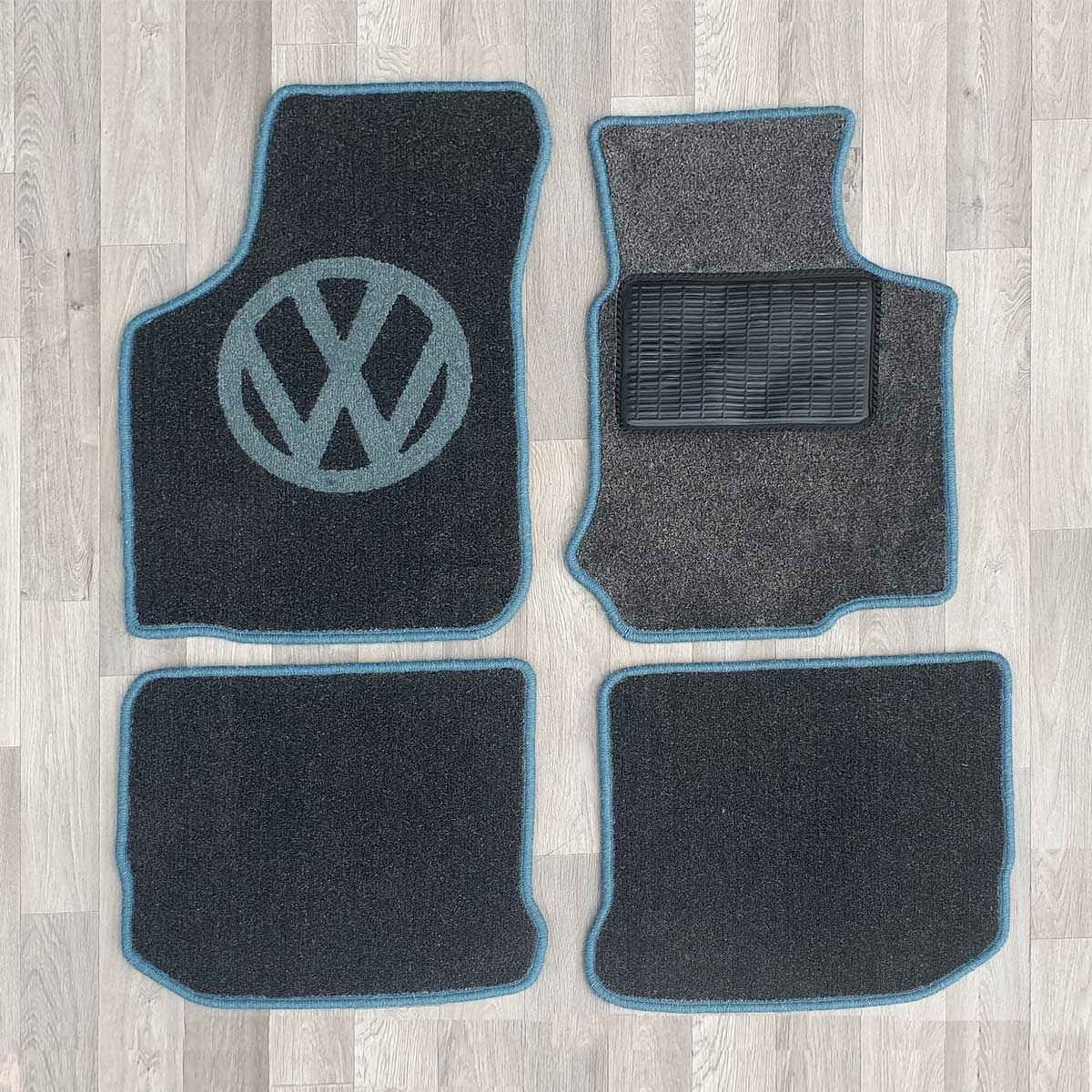 New Beetle rug set shown in dark grey carpet with blue binding.