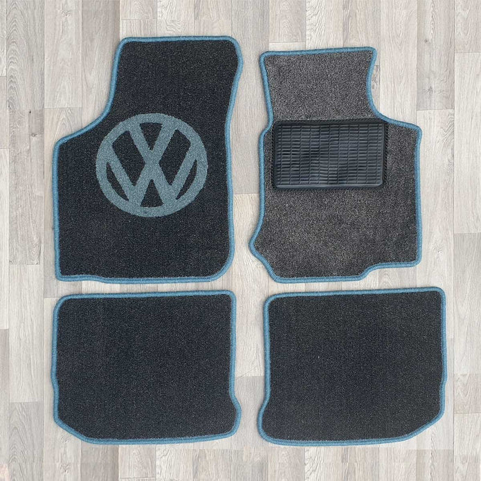 New Beetle rug set shown in dark grey carpet with blue binding.