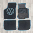 New Beetle rug set shown in dark grey carpet with blue binding.