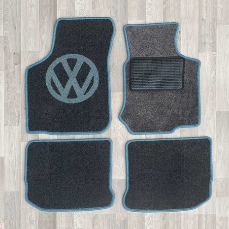 New Beetle rug set shown in dark grey carpet with blue binding.