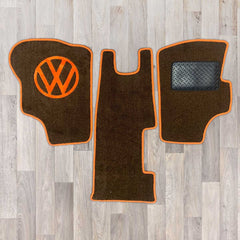 T25 3 piece cab mat set shown in black carpet with orange binding
