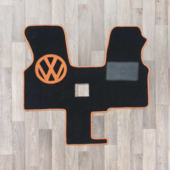 T4 1 plus 1 seat arrangement cab mat shown in black carpet with orange binding and logo