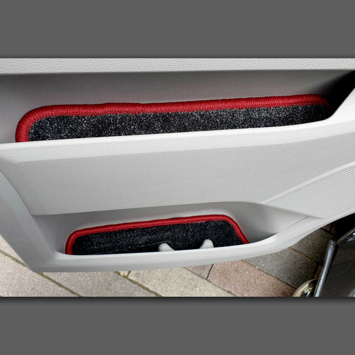 T5 door pocket liners shown in door pockets, in grey carpet with red binding