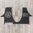 T6.1 December 2019 onwards model cab mat with 2 plus 1 kiravan seat arrangement shown in black with grey trim and VW logo