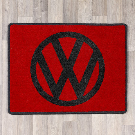 rectangular rug with vw logo in red and black