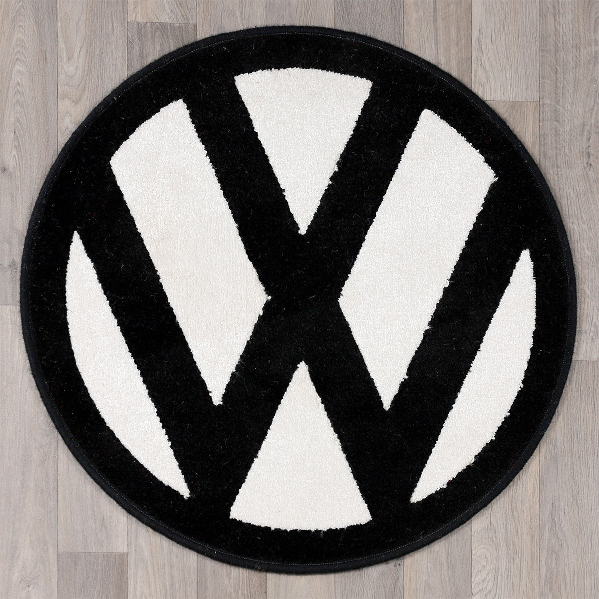 round rug with vw logo in black and white colours